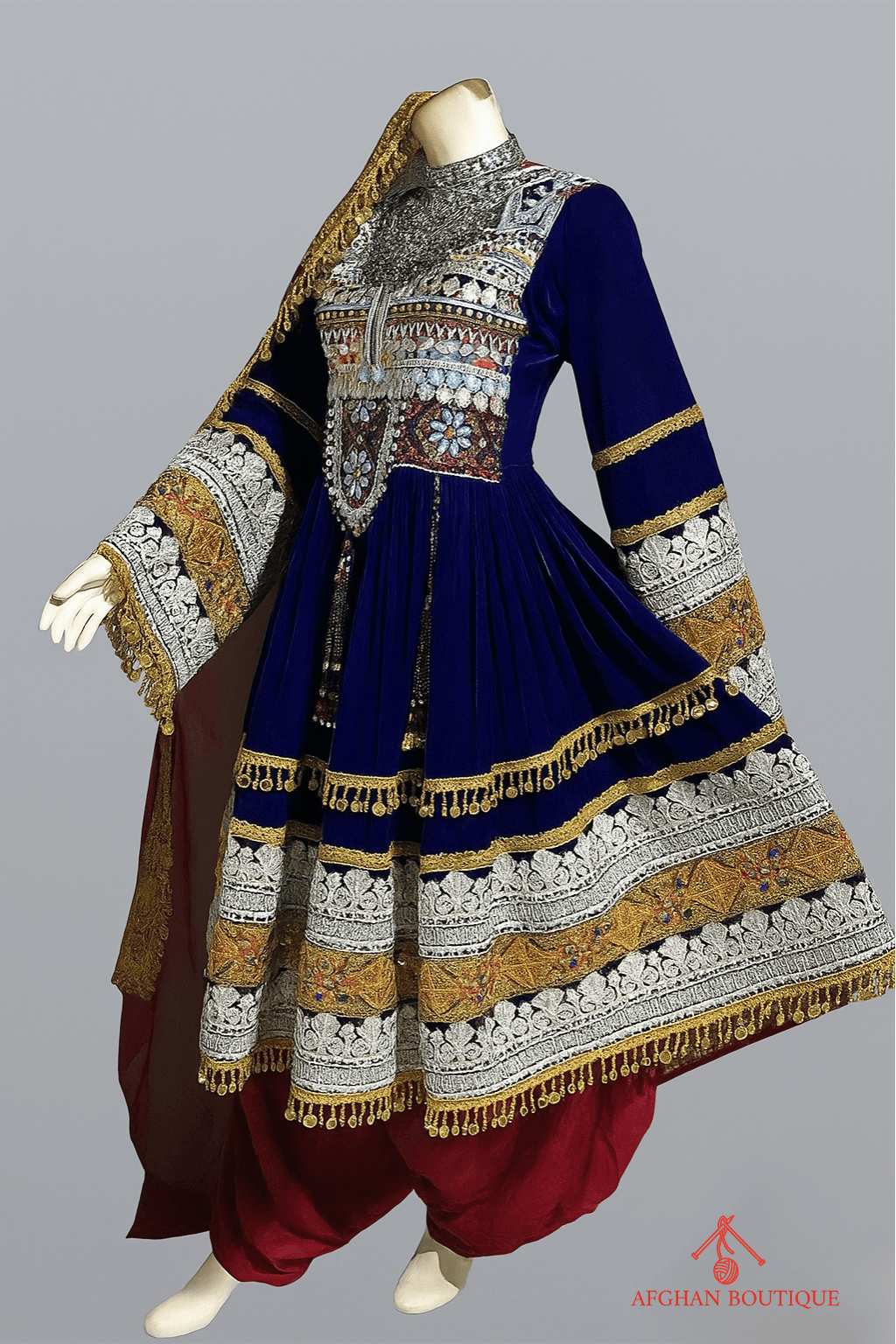 Left view of blue Afghani frock with handcrafted stitching patterns
