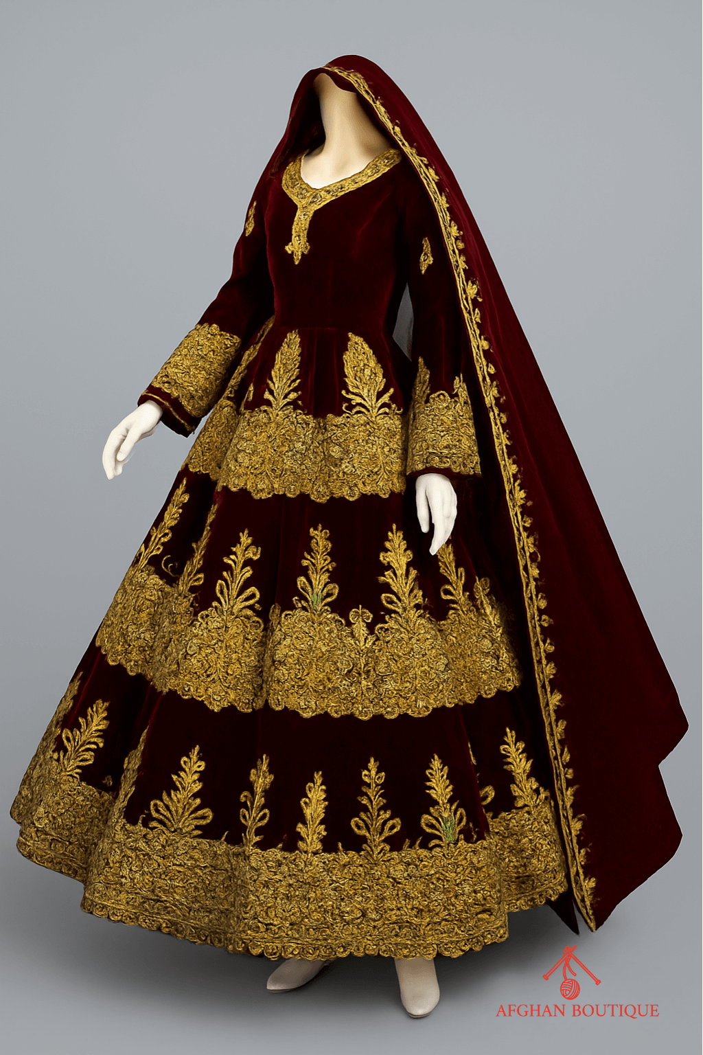 Left angle of golden Afghani maxi with traditional embroidery patterns