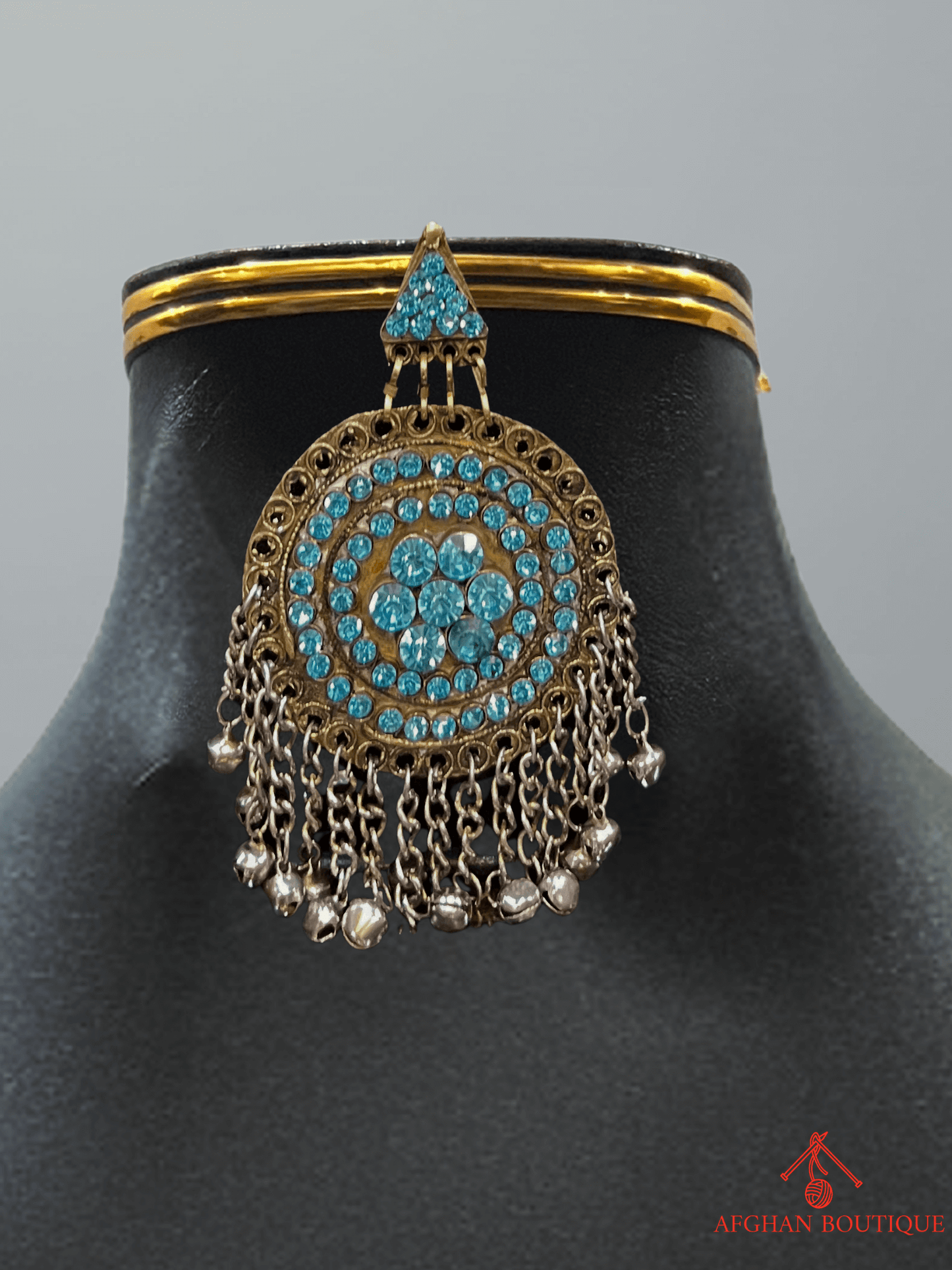 Light blue handcrafted Afghani headpiece close-up