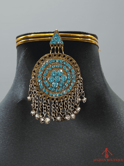 Light blue handcrafted Afghani headpiece close-up