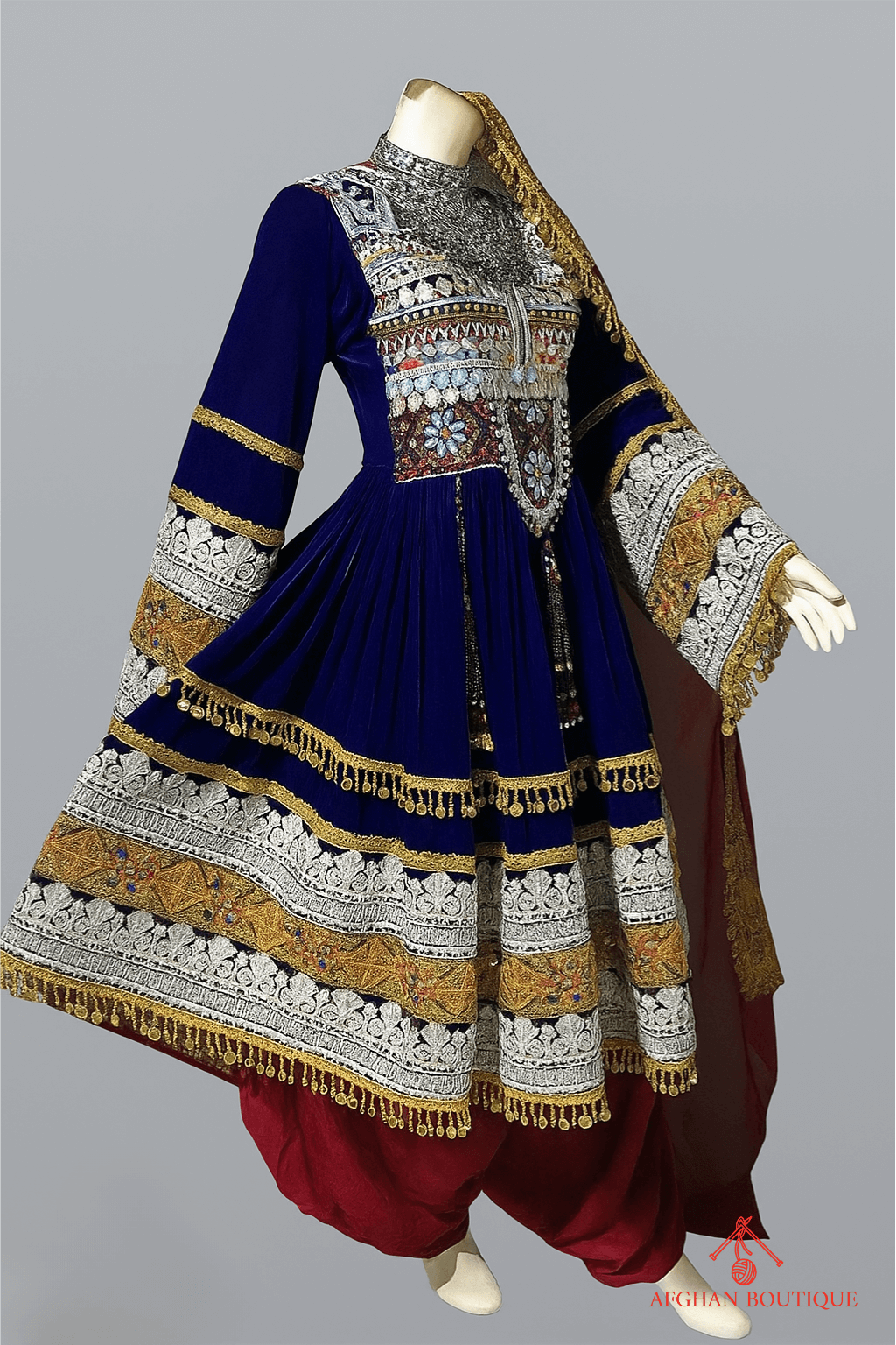 Right side of blue Afghani frock showing golden thread detailing
