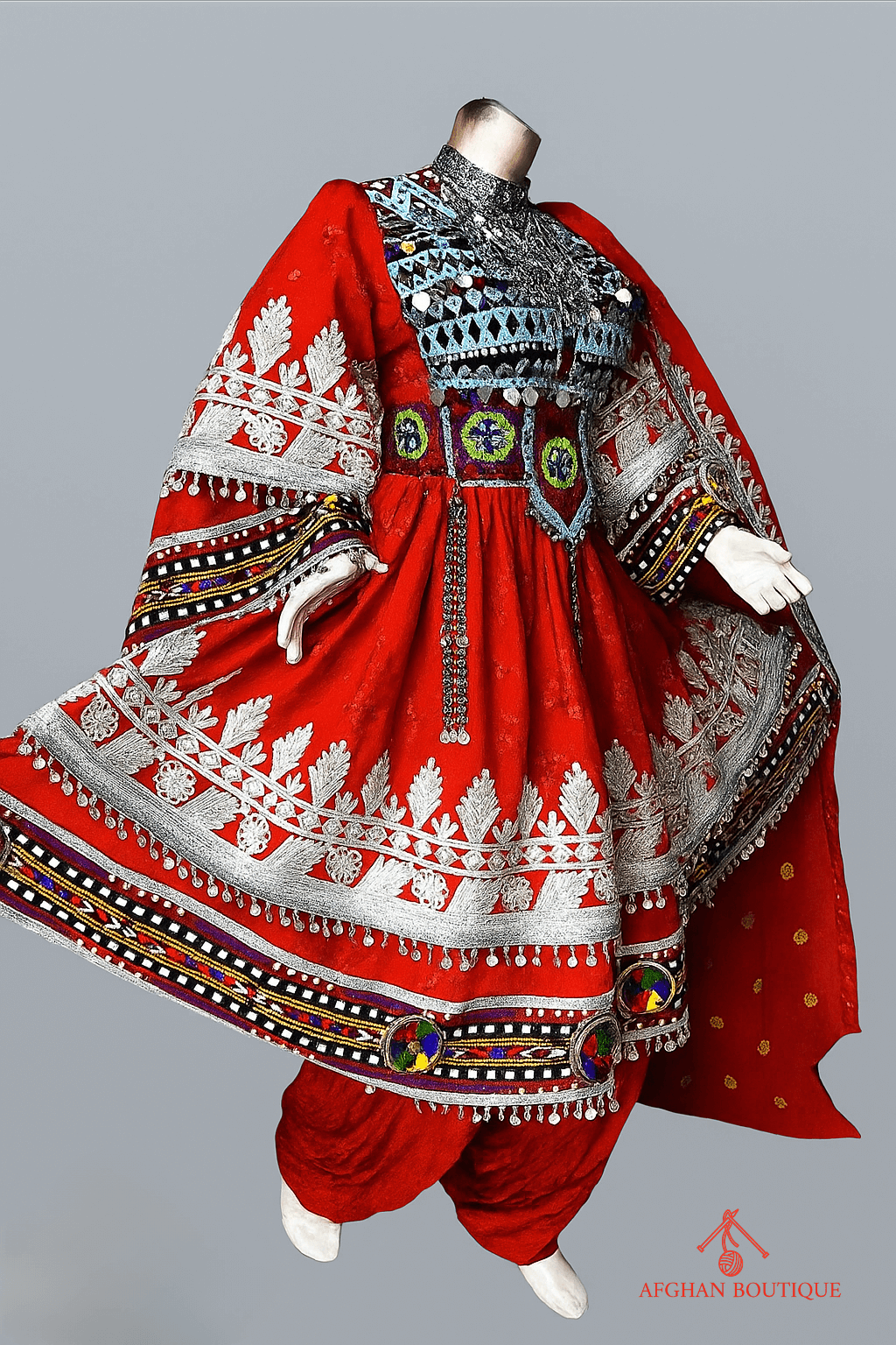 Right side of classic red Afghani frock showing elegant handwork
