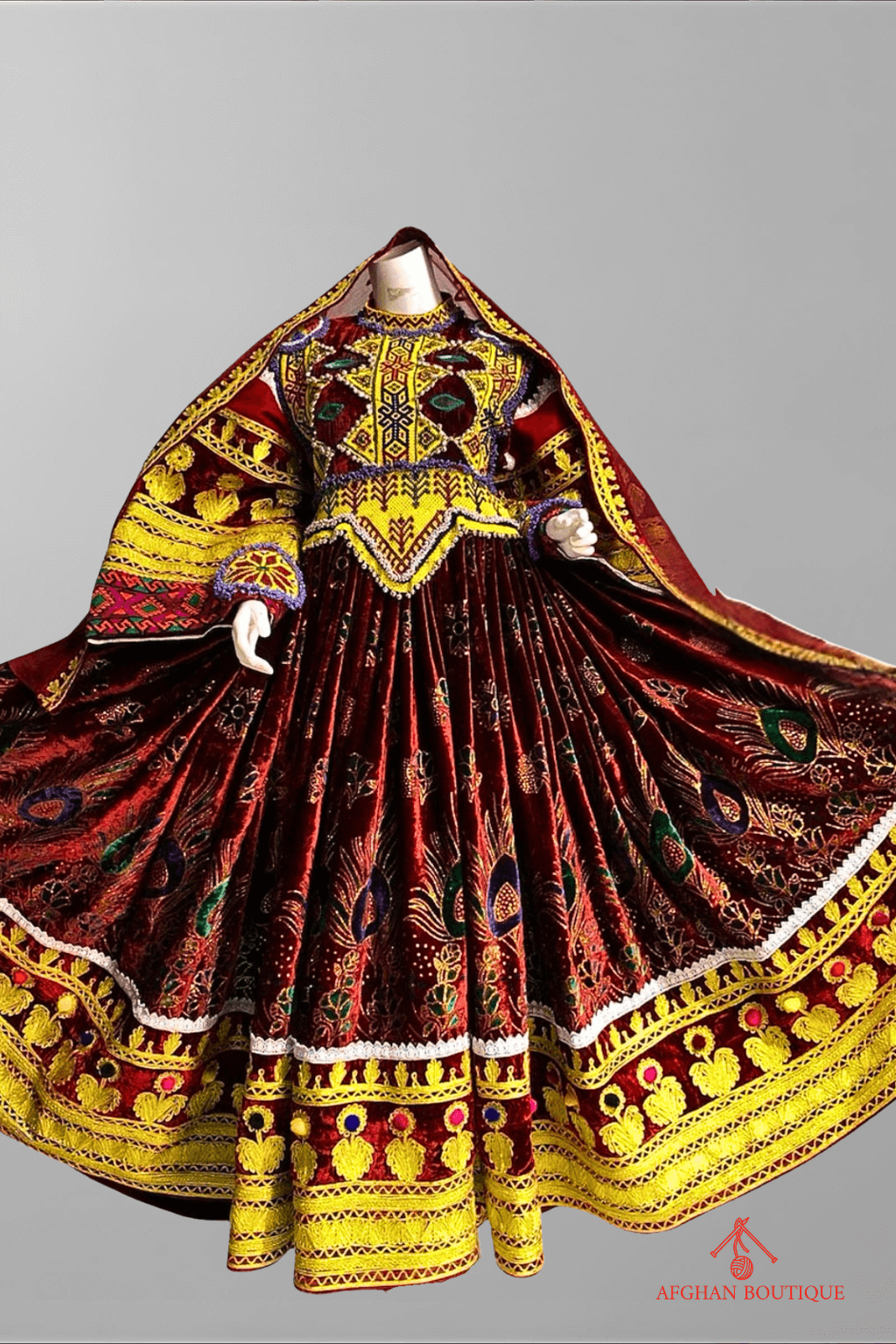 Front view of deep wine Afghani frock with yellow embroidery design
