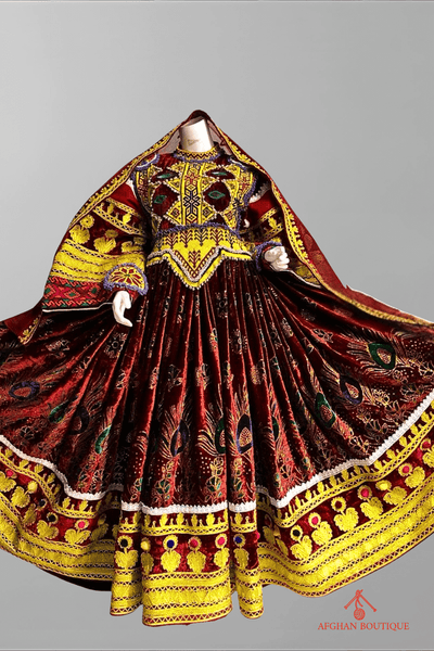 Front view of deep wine Afghani frock with yellow embroidery design
