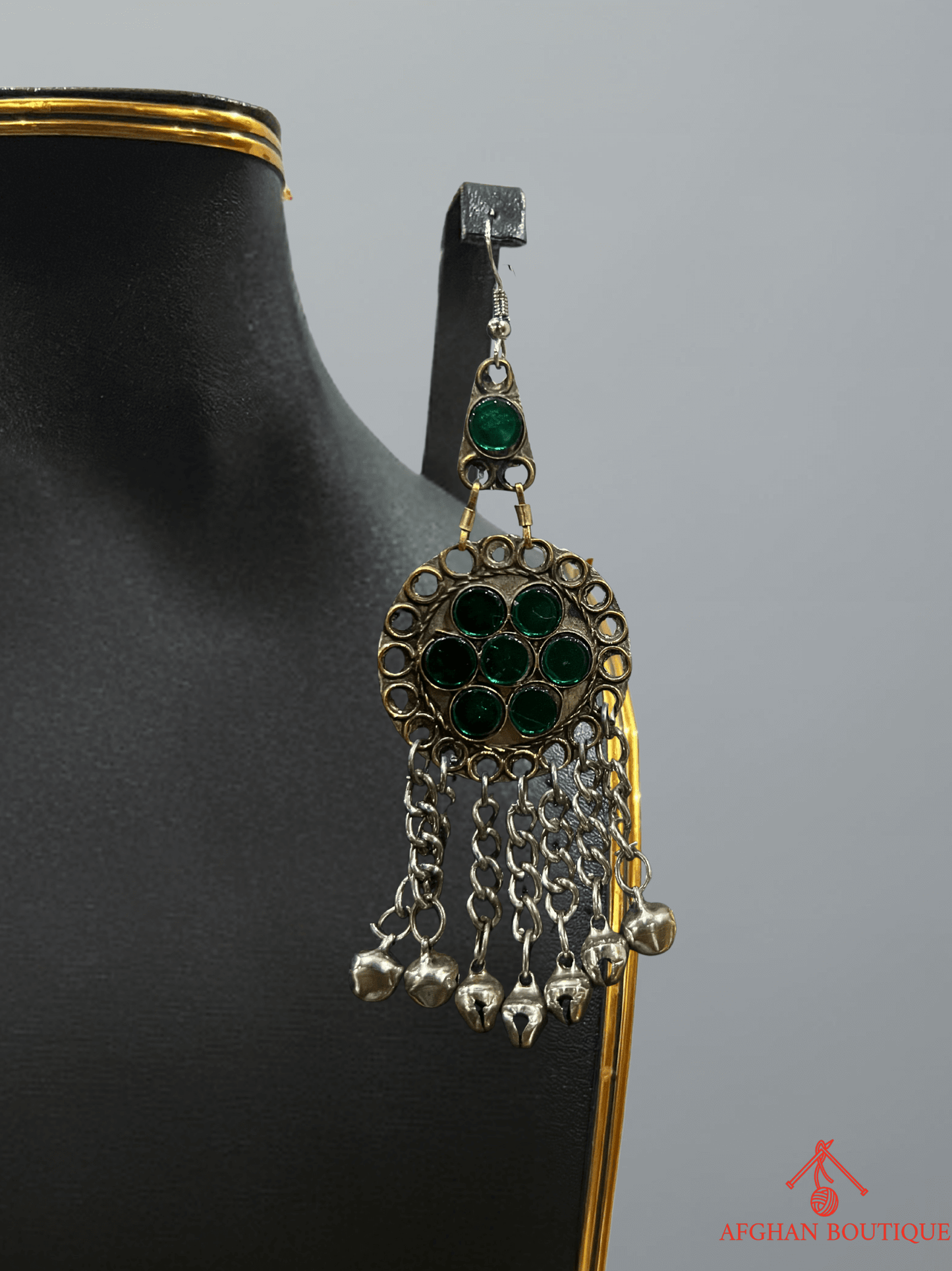 Left earring from emerald green Afghani handcrafted jewelry set, showcasing ethnic handmade detailing and traditional design.