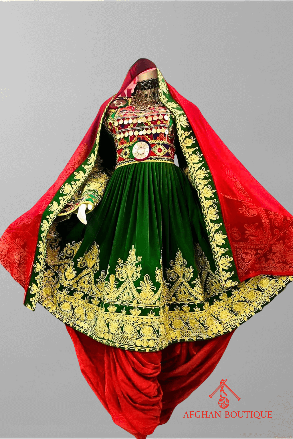 Front view of green and red Afghani frock with golden embroidery work
