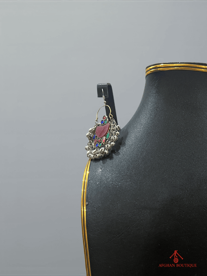 Close-up of right multicolor handcrafted Afghan earring featuring colorful gemstones and artisan detailing.