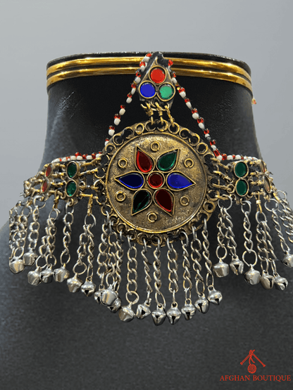 Close-up view of handcrafted Afghani headpiece showing intricate detailing, ethnic tribal jewelry craftsmanship.