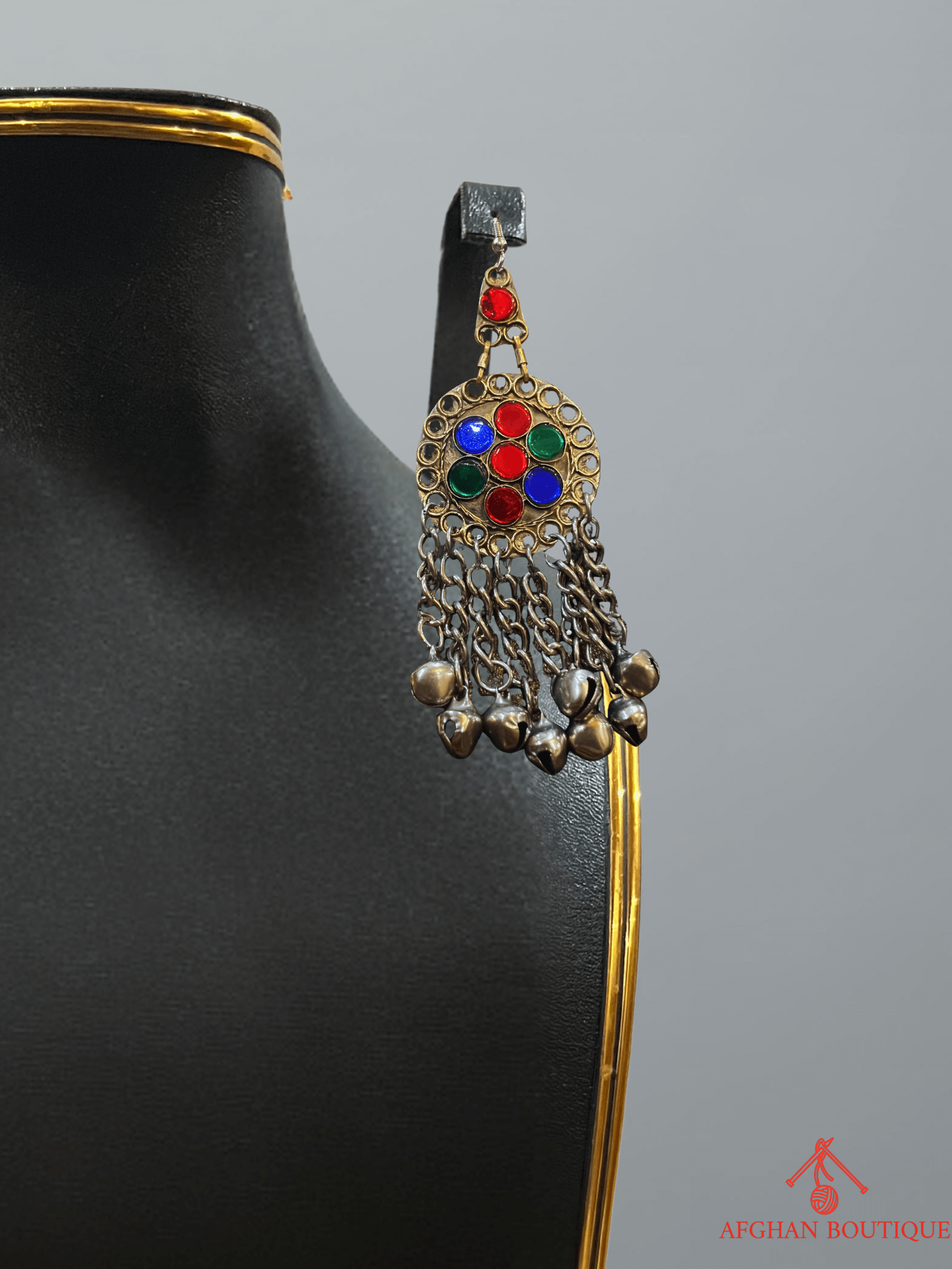 Left earring from handcrafted Afghani jewelry set, featuring colorful tribal stones and traditional ethnic detailing.