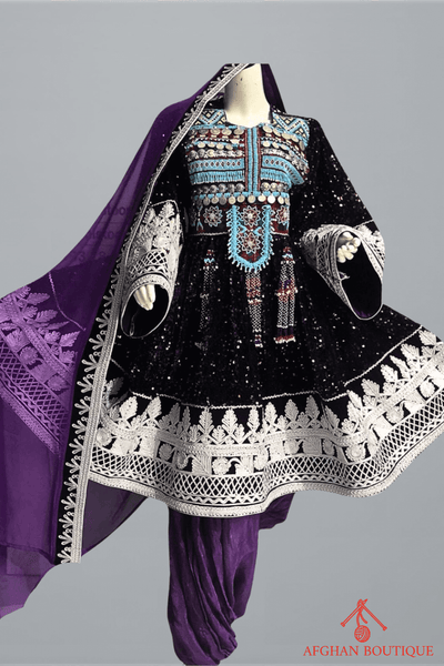 Front view of purple Afghani frock with white embroidery work
