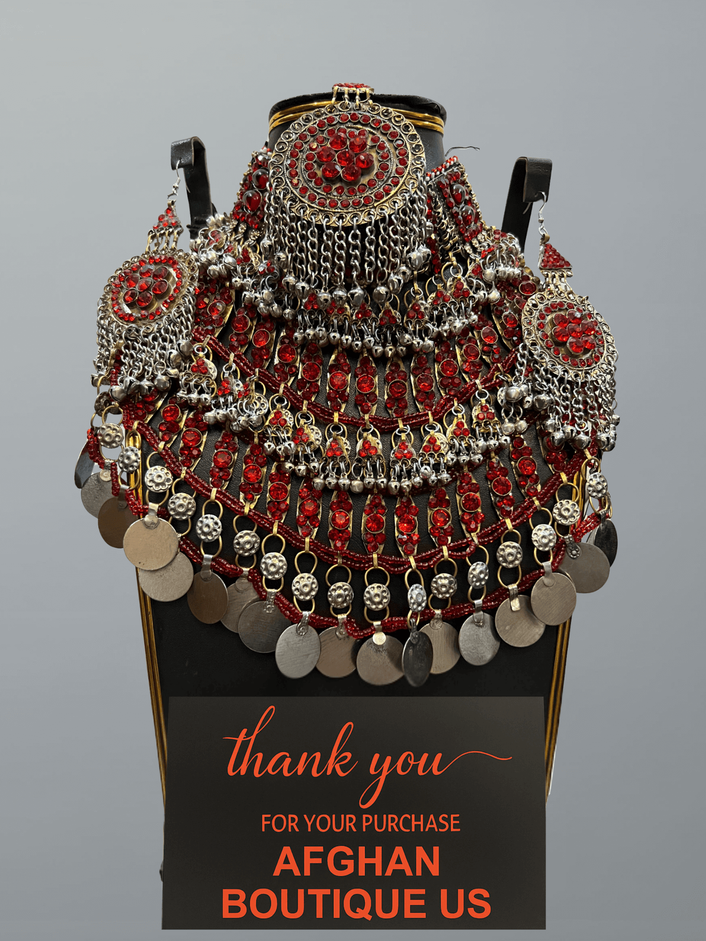 Red handcrafted Afghan jewelry full set featuring traditional necklace, headpiece, and earrings — elegant tribal craftsmanship.