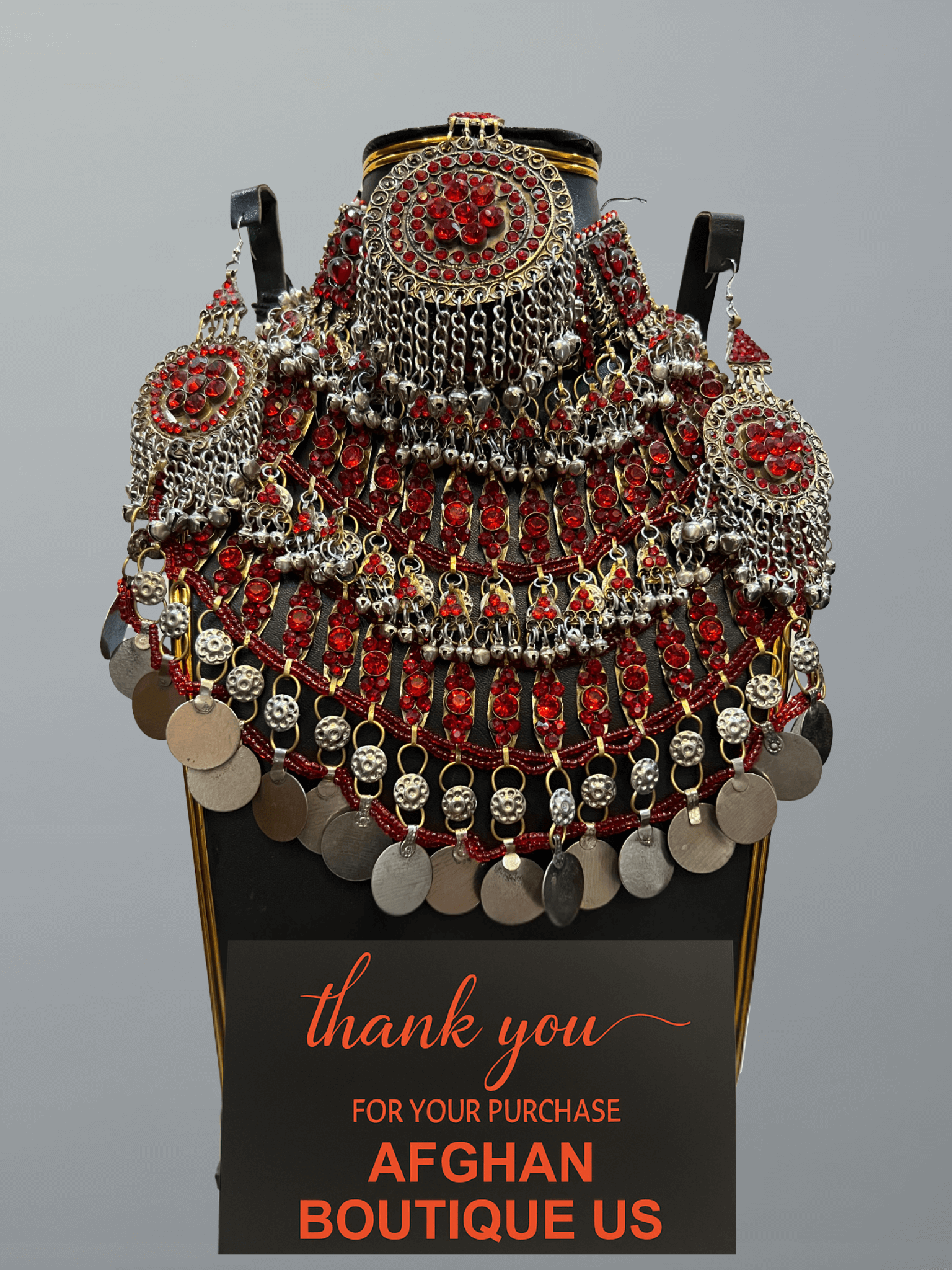 Red handcrafted Afghan jewelry full set featuring traditional necklace, headpiece, and earrings — elegant tribal craftsmanship.