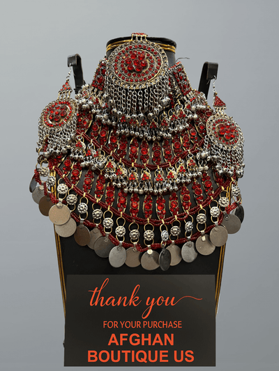 Red handcrafted Afghan jewelry full set featuring traditional necklace, headpiece, and earrings — elegant tribal craftsmanship.