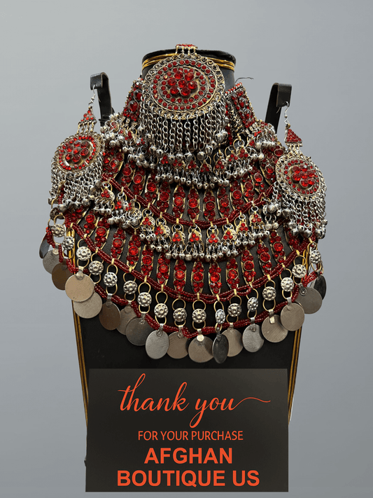 Red handcrafted Afghan jewelry full set featuring traditional necklace, headpiece, and earrings — elegant tribal craftsmanship.