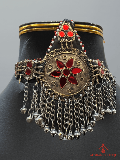 Red and gold handcrafted Afghani headpiece close-up