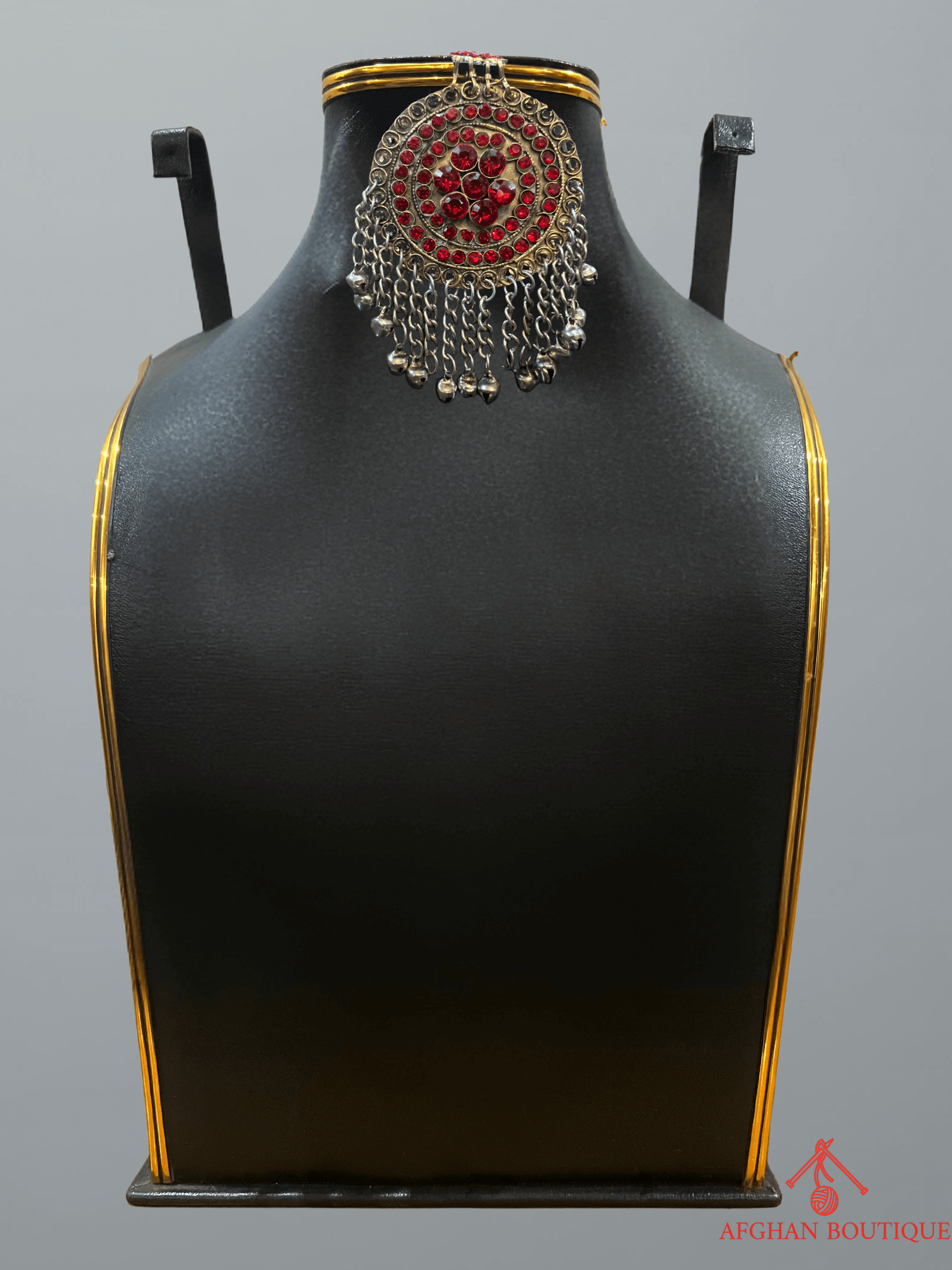 Handcrafted red Afghan headpiece showcasing tribal artistry and elegant craftsmanship.