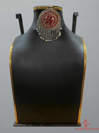 Handcrafted red Afghan headpiece showcasing tribal artistry and elegant craftsmanship.