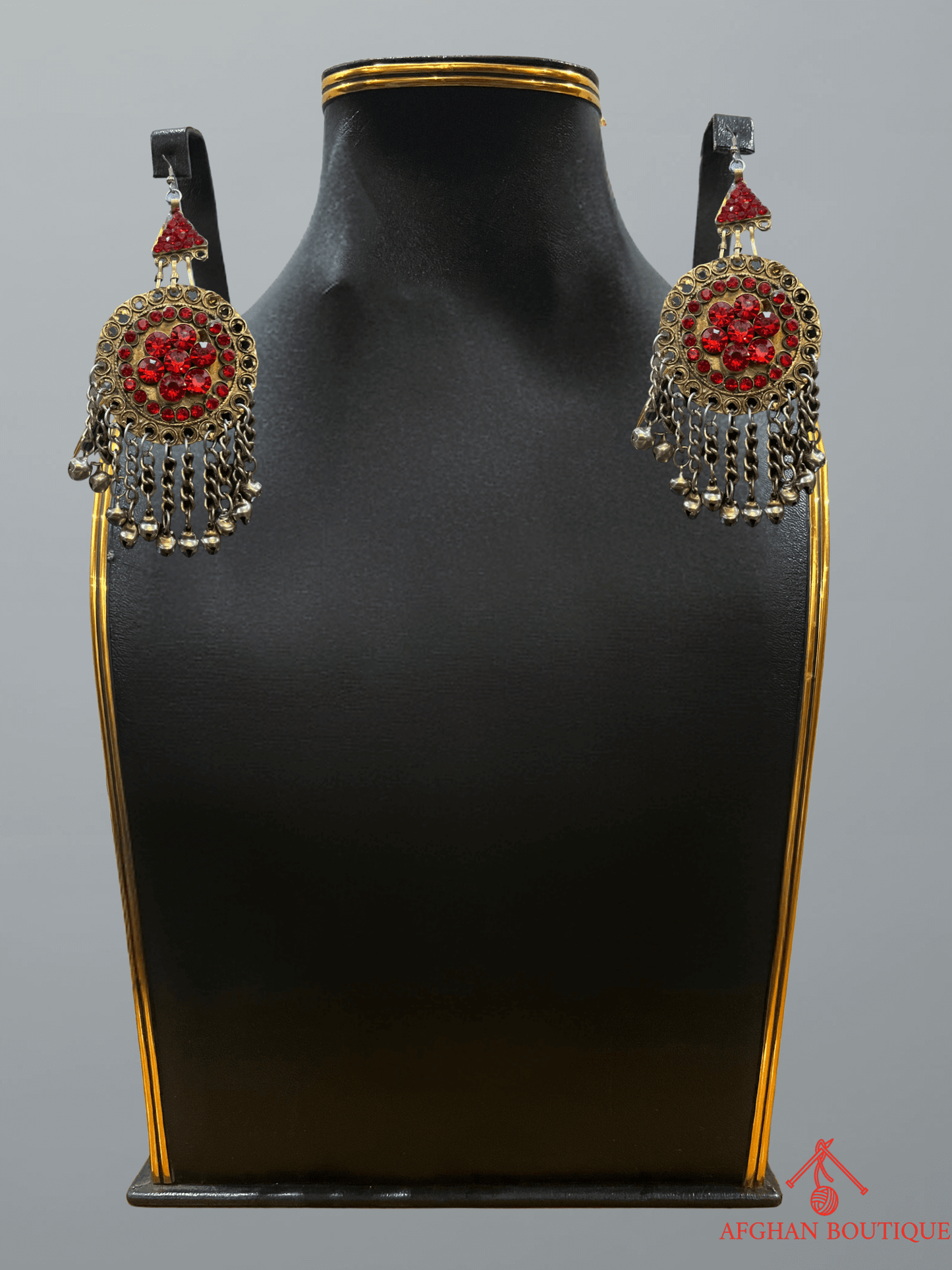 Pair of red Afghan earrings featuring traditional patterns and fine detailing.